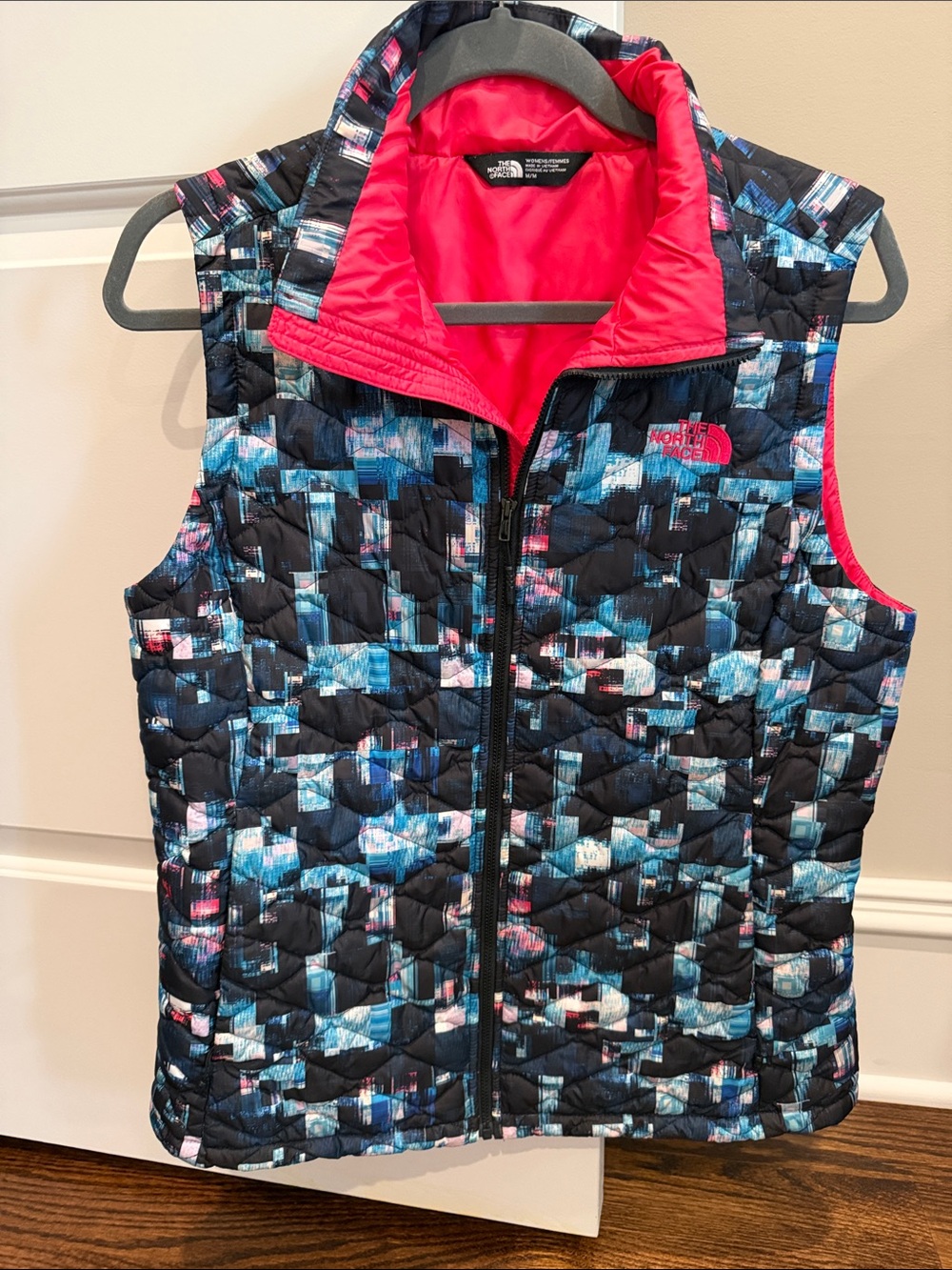 The North Face Ladies Quilted Vest - Black with Pink & Blue geometric Pattern